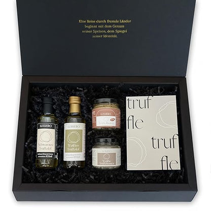 Geöffnete Geschenkbox mit Trüffelölen, Trüffelbutter und Sauce